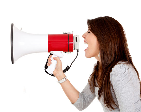 lady using megaphone to call others to action